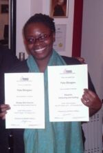 Happy Simply Afro Student receiving certificate
